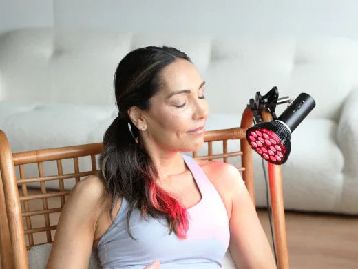 A Woman Relaxing while using Lifepro InfraGlow