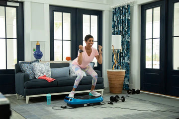 woman on vibration plate exercising