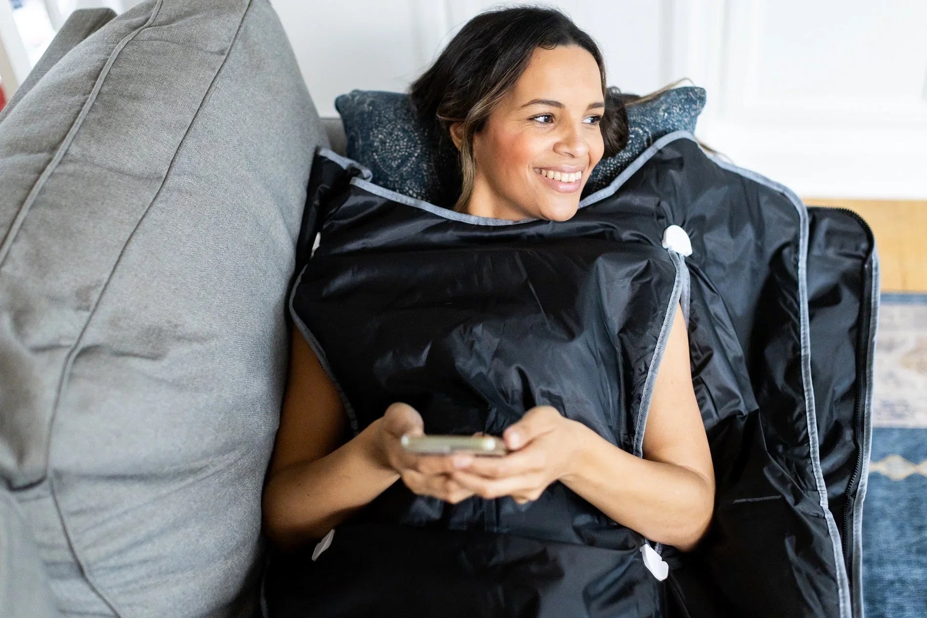 Woman using sauna blanket