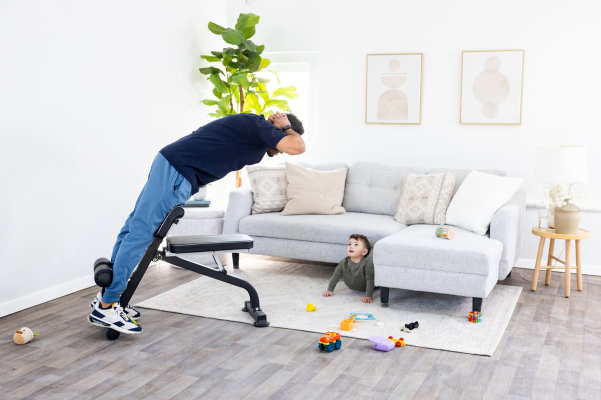 Man using Roman chair for lower back exercise