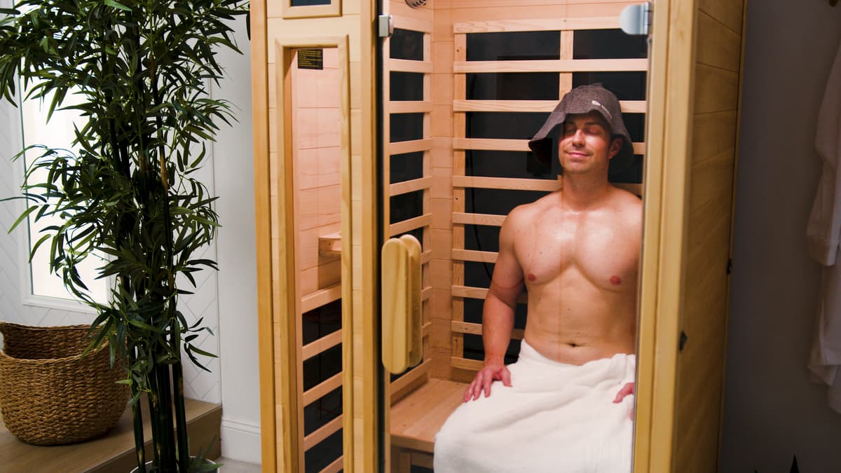 Man using sauna wearing sauna wool hat