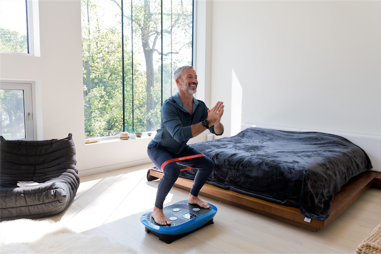 Rumblex Plus Vibration Plate with a man standing on it