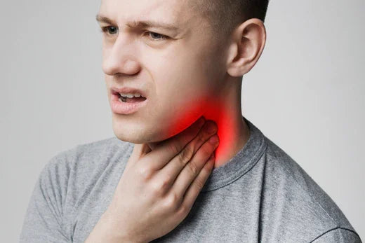 EDU Young man suffering from tonsillitis, pulping his neck