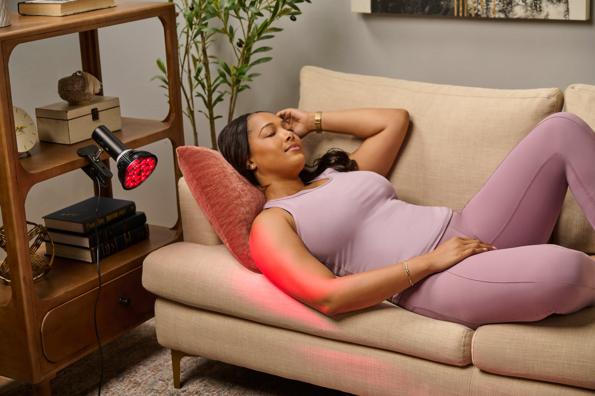 Woman using red light therapy