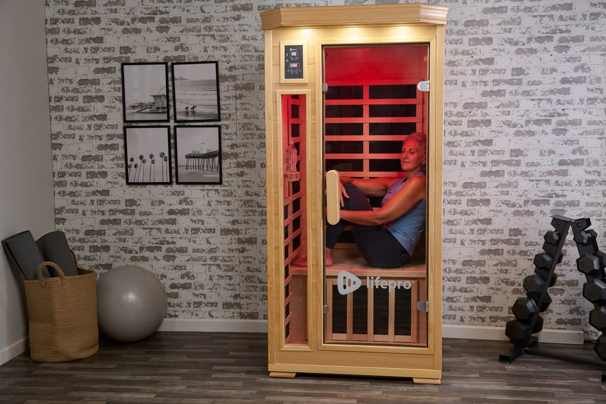 Woman using single person sauna