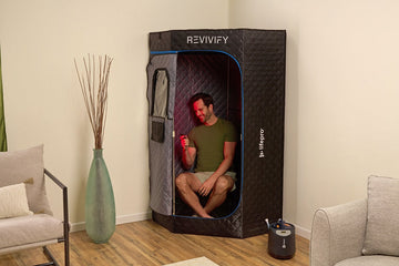 Man sitting inside home steam room