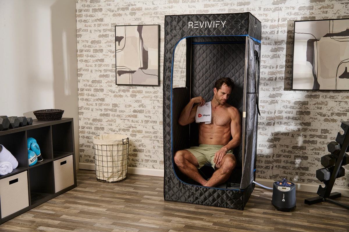 Man sitting inside home steam room