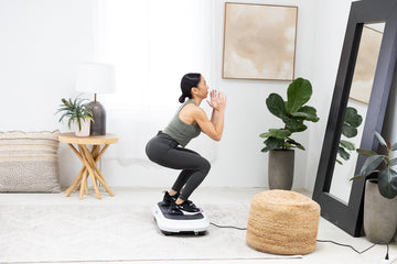 Woman using vibration plate