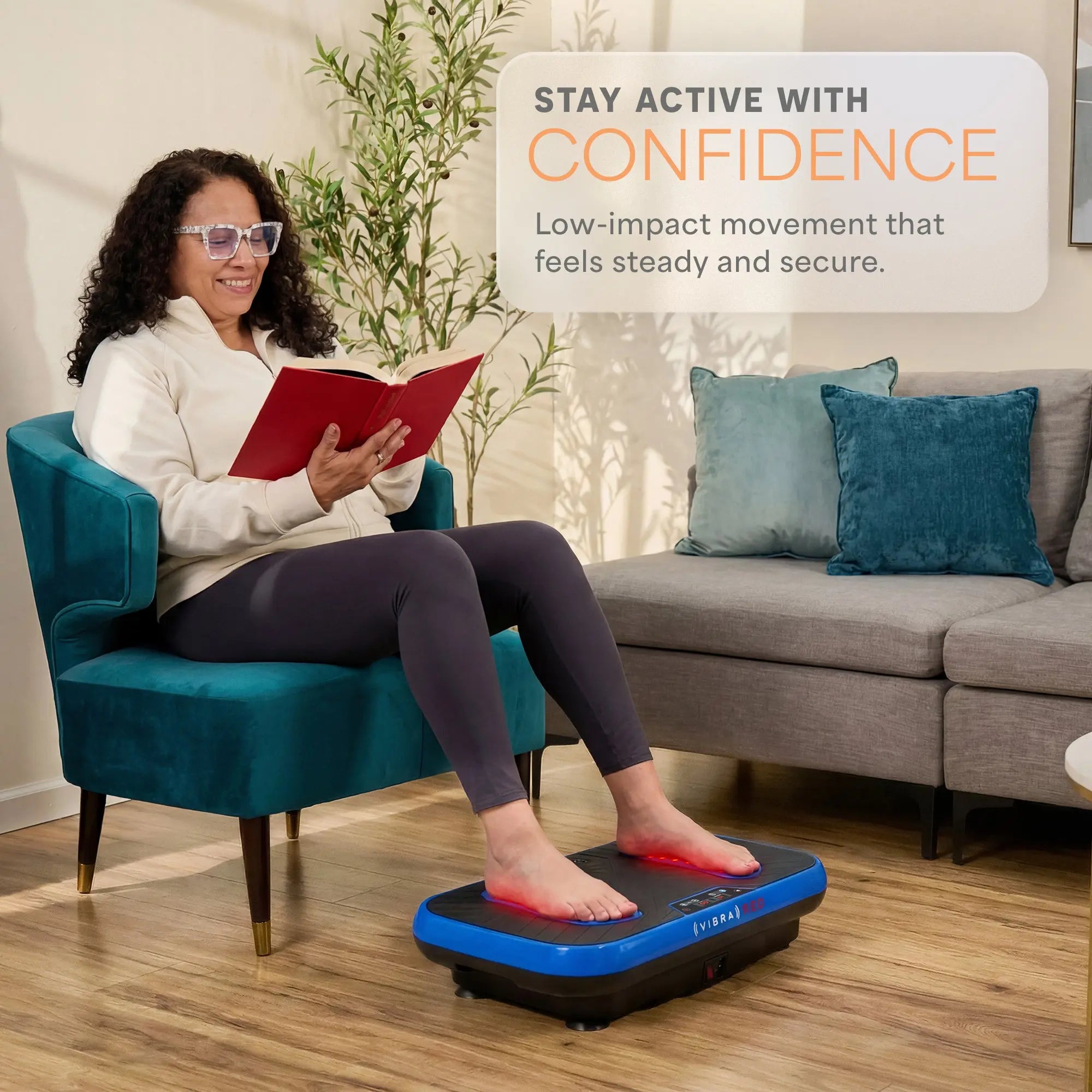 Woman using a vibration plate in a living room with text about staying active with confidence.